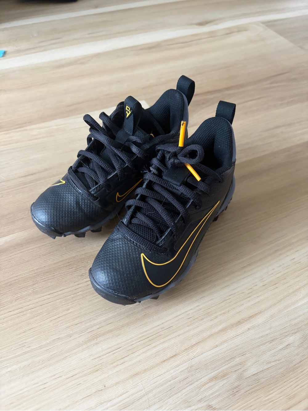Nike Kids Black and Yellow Cleats